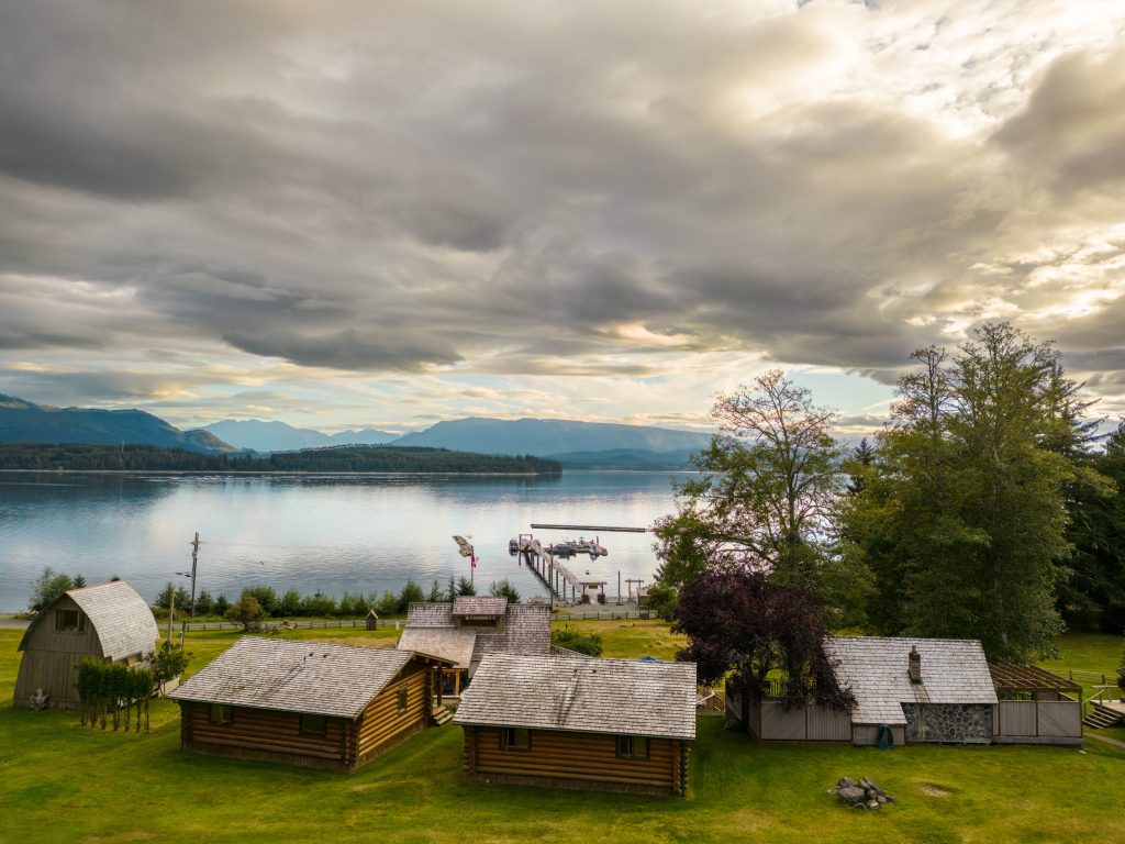 Cabins and lawn beside the water