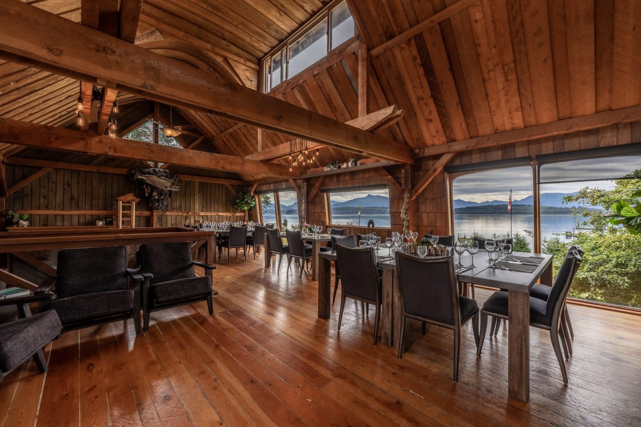 Elegant Sea Wolf Lodge dining room with timber frame construction and ocean views