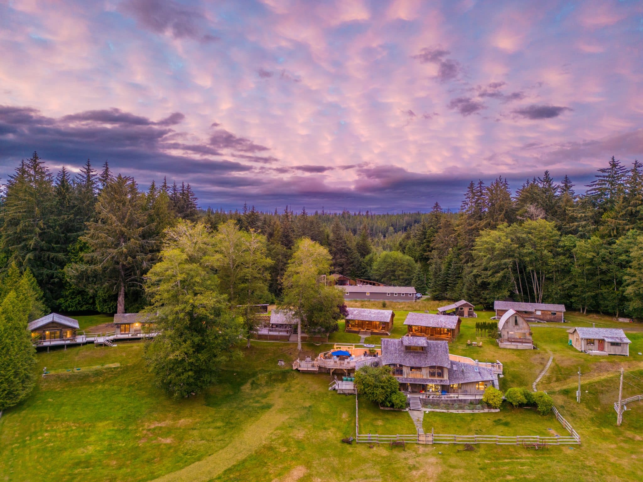 Sea Wolf Lodge compound at sunset on Malcolm Island, showing respectful integration with Great Bear Rainforest landscape